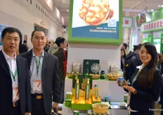 Lu Ling Manor produces walnuts in Hebei province. The company is part of the Hebei Province Pavilion alongside other local producers. To the left Jia Ying Jie and Wang Qun Feng