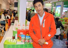 Yong Jun produces peach juice. He is part of the Hebei Province Pavilion