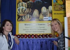 Hollie Manier and Tyann Schlimmer with Bay Baby Produce in front of their 12 decorated Christmas apples. Customers can choose from a number of designs.