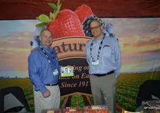 John Heffernan and Kasey Kelley with Naturipe Farms showing the award winning snack packs of blueberries.