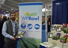 Ashley Rawl with WP Rawl showing seasonal harvest kale.