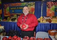 David Anthony of Ruby Fresh showing pomegranates in the booth of Nathel & Nathel. The company markets Ruby Fresh's pomegranates in the NY area.
