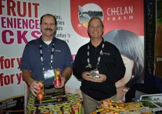 Bill Dinham and Mac Riggan with Chelan Fresh showing Rockit apples and the Cup O'Cherry packaging.