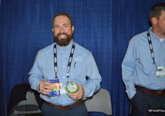 John Alderman with Duda Farm Fresh Foods shows celery sticks with peanut butter on the left and a brand new product on the right: celery sticks with a veggie dip.