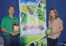 Anthony Perez and Arit Brener with M&R Farms showing organic spring mix and watercress.