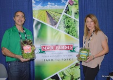 Anthony Perez and Arit Brener with M&R Farms showing organic spring mix and watercress.