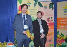 Lorenz Hartmann de Barros and Rubens Zylberkan with HLB Specialties showing organic Formosa papayas.