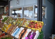 Cashier booth with produce selection in front.