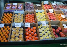 Persimmons, Asian pears, quinces and pomegranates on display.