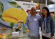 Yoav Cohen from MS Mango Farm, LLC and his daughter, featuring Puerto Rican mangoes in the SUSTA group stand. The company has recently started exporting green mangoes to the continental US.