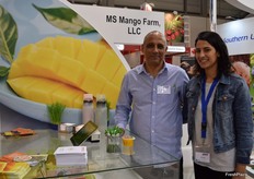 Yoav Cohen from MS Mango Farm, LLC and his daughter, featuring Puerto Rican mangoes in the SUSTA group stand. The company has recently started exporting green mangoes to the continental US.