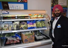 Shehbaz Singh, Principal Scientist for Apio, showcasing the various forms of packaging for fresh cut vegetables.