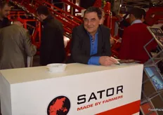 Georg Prasow from Sator (Agrotop), with carrot harvester, the Sator XXL Box F on display behind him.
