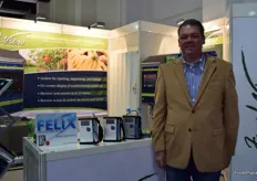 Michael Larman, General Manager for Felix Instruments in front of the F-750 Produce Quality Meter.