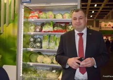 Marcin Kusmierowski, Chairman of the Board for Green Factory Bronisze (member of the Primavega Group), in front of the company's various packaged vegetables.
