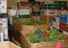Radishes, carrots and a range of leafy greens took centre stage among smaller boxes of produce in this aisle of the growers area.