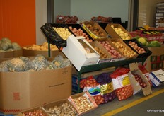 A wide variety of pumpkins, potatoes, onions, ginger and some watermelons and limes on the Buyer's Walk.