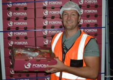 Brent Geddes from Pomona shows his pomegranates which have just been packed.
