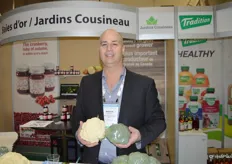 Martin Cousineau of Jardins Cousineau shows cauliflower and broccoli, the company's main products.