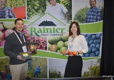 Shea Carroll and Blaine Markley with Rainier Fruit, showing different products the company has to offer: blueberries, cherries, pears and apples.