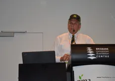 John Dollisson Apple and Pear Australia took off his suit jacket and put on his cap to speak from a grower's point of view.