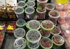 Blueberries are very popular, and buckets of cherries are also given much space.