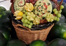 This artwork of fruit accompanies the watermelon display.