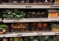 Avocados and coconuts are nearly invisible in the cold store.