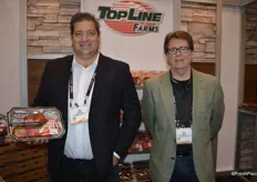 Dino Dilaudo and Matt Wright with Westmoreland-TopLine Farms. Dino shows the company's new organic Tomato on the Vine product.