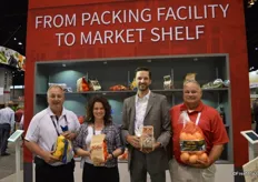 Andy Duff, Marsha Verwiebe, Daniel Mueller and Kevin Fischer showing different packing products of Volm Companies.