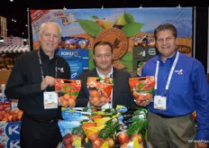 Steve Lutz, Don Patella and Bob Mast with Columbia Marketing International, showing apricots that are in season currently.