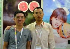 Wen Min Dong, to the right, is the President of Pinghe Flourish Fruit Industrial. The company grows pomelo in Pinghe. To the left is Xing Wu of Boliya Printing