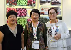Katherine, to the right, is the export manager of Long Yuanhong Fruits Selling, an apple grower and exporter