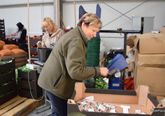 Workers packaging Brussel Sprouts for a major supermarket chain.