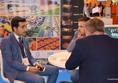 Askin Ucak, speaking with visitors at the Ucak stand.