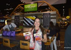 Helen Aquino with Village Farms proudly shows the 5oz. bags with heavenly villagio marzano tomatoes. They are now available at Disney Parks as well as the Epcot Food & Wine festival.
