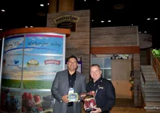 Jerry Moran and Archie Taylor with Naturipe Farms. Jerry shows the compostable recyclable organic blueberry package and Archie shows a package with cranberries.
