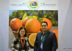 Montasser Rashwan of Nahdet Misr invites Diana of Laiwu Taifeng Foods at his stand.
