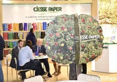 Lorenzo and Fabrizio Govi with a client at the Ciesse Paper stand.