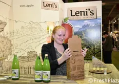 Barbara while she places two bottles of Leni's juice in a practical branded box.