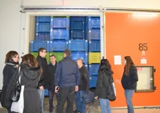 Visitors taking a look into the cold storage unit.