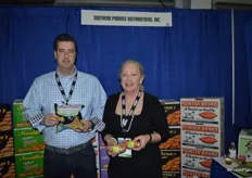Kelley Precythe and Brenda Oglesby with Southern Produce Distributors showing microwaveable sweet potatoes.