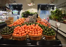 Different tomato options displayed with avocados. The produce manager mentioned that avocados are a very popular product in this store.