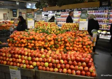 Promotional display that includes Junami apples and stem & leaf satsuma's. The signs clearly show that this is a promotional item.