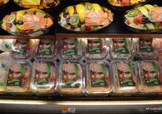 Pre-cut fruit platters and organic apple slices.