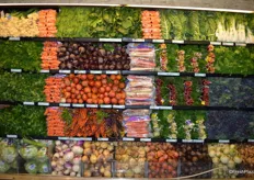 According to the store's produce manager, this section with root vegetables is very popular. Because of high demand, he mentioned it is difficult to keep this section look pretty.
