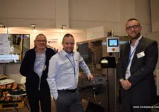 Gunner Hansen, Morten Berenth Nielsen and Mads Nychel from Egatec, showing their machine which sorts packaged goods into crates.