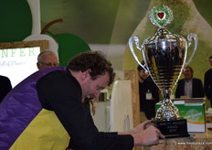 The sticker for Portugal being adding to the Health Wonder Award 2017 trophy.