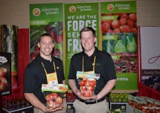 Conner O'Malley and Tyler Weinbender with Domex SuperFresh Growers show pouch bags of Autumn Glory apples and organic apples.