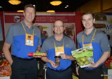 Tim Evans, Gil King and Eric Martinson with Chelan Fresh, proudly showing Rockit apples, the cherry cup and a pouch bag with pears.